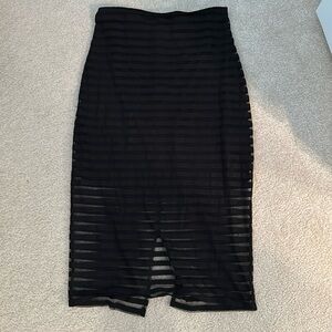 Bebe midi skirt with beautiful striped detailing. Sheer material overlay